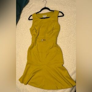 Sleeveless dress with gold detail on the front